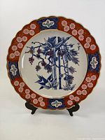 Front view of Imari platter showing full design and stand