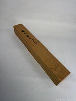 Top view showing calligraphy on wooden box