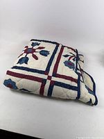 Quilt folded to show pattern and binding