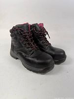 Full side and front view of both boots showing overall condition