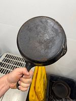 Underside view of skillet showing overall condition and patina