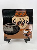 Front view of entire Arius art tile on stand