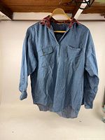 Front view of Northwest Blue denim shirt jacket on hanger