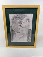 Full view of framed pencil portrait