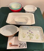 All nine pieces displayed together on table