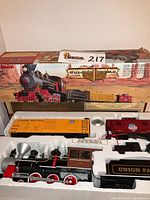 Boxed Bachmann Golden Spike train set with locomotive, tender, boxcar, caboose in foam