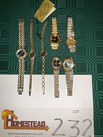 All seven watches laid out on surface