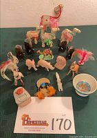 Group shot of all souvenir figurines and trinkets arranged on table