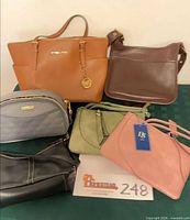 All six handbags displayed together
