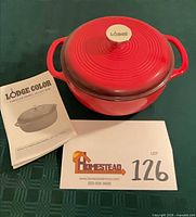 Dutch oven with lid, instruction booklet visible