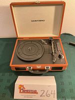 Musitrend suitcase turntable open showing controls and platter