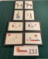 Group shot of all eight framed drawings
