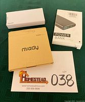Three boxed power banks on table