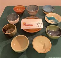 Top view of all nine bowls and pie plate