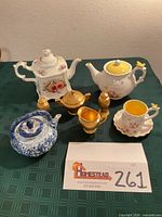Group shot of all nine porcelain pieces on table