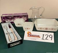 Full lot with boxed caddies, boxed carving set, three casseroles, crystal pitcher
