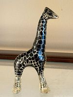 Full view of lucite giraffe sculpture