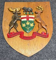 Full view of walnut shield plaque with complete Ontario coat of arms