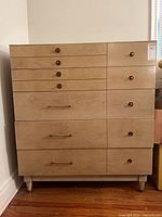Full front view of dresser showing drawers, pulls, legs