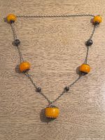 Full view of necklace laid flat showing bead arrangement and overall design