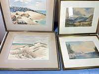 All four framed watercolors displayed together