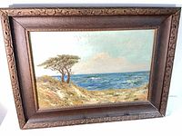 Framed oil painting coastal scene with trees