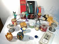 Overall view of all candles, holders and boxed tapers on table