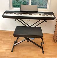 Front view of Casio PX-150 on X stand with bench
