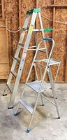 Side view of 6-ft Werner ladder and two-step folding ladder