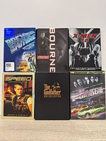 Front view of all six DVD box sets