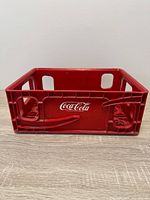 Front view showing Coca-Cola logo and side openings