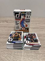 Two stacks of Donruss NBA cards with retail box behind
