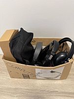 Box containing headphones and electronics