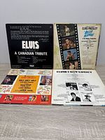 Back covers of Blue Hawaii and A Canadian Tribute with track listings