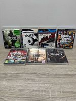 Front view of all seven PS3 game cases