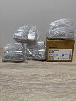 Five sealed ResMed HumidAir water tubs, four loose and one boxed