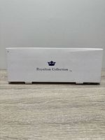 Closed white box showing Royalton Collection logo
