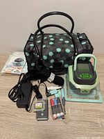 Full lot: cutter, bag, power adapter, tools, mat, cartridge visible