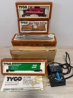 Group shot showing all boxed cars, track pack, power pack and leaflet