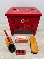 Full view of wooden shoe shine box and accessories