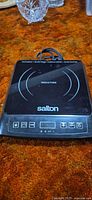 Top view of Salton induction cooktop showing cooking surface and control panel