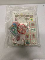 Front view of sealed package showing Christmas Bingo boards, chips and stamp set