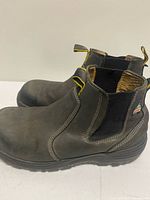 Left side view of both boots showing leather upper and outsole