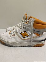 Lateral view of both sneakers showing colourway and soles