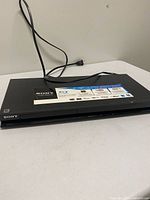 Full view of Sony BDP-S370 player with power cord