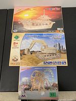 Fronts of all three boxed kits