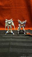 Both built Gundam AGE figures side by side