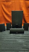 Full set of Sony subwoofer, center speaker, four satellites