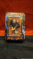 Front of decorated metal tin with Star Wars Dark Empire II artwork
