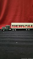 Side view of RC semi truck with Servall trailer